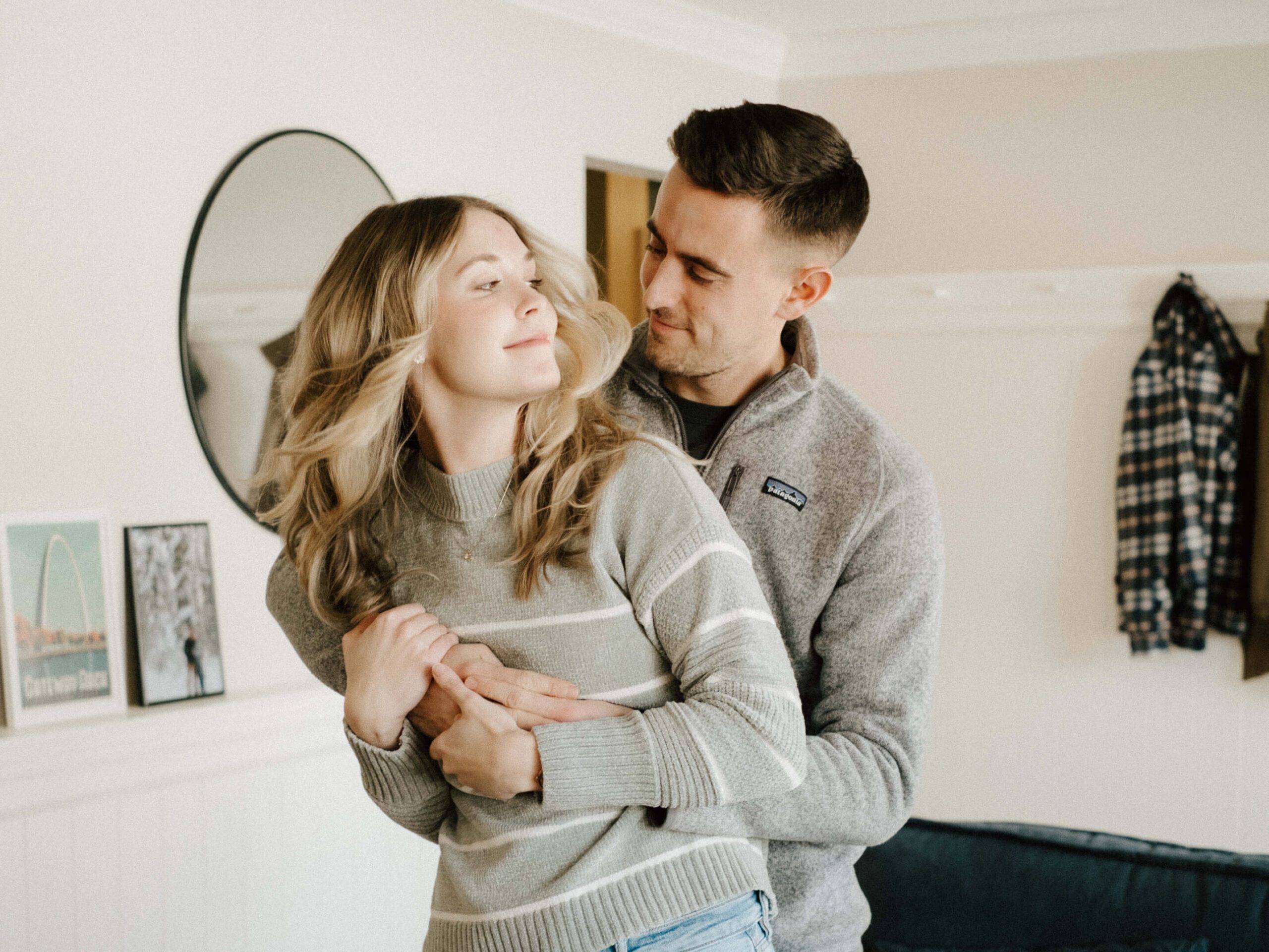 Happy couple dancing at their home in St. Louis, captured with a nostalgic film aesthetic by Stacey Vandas Photography.