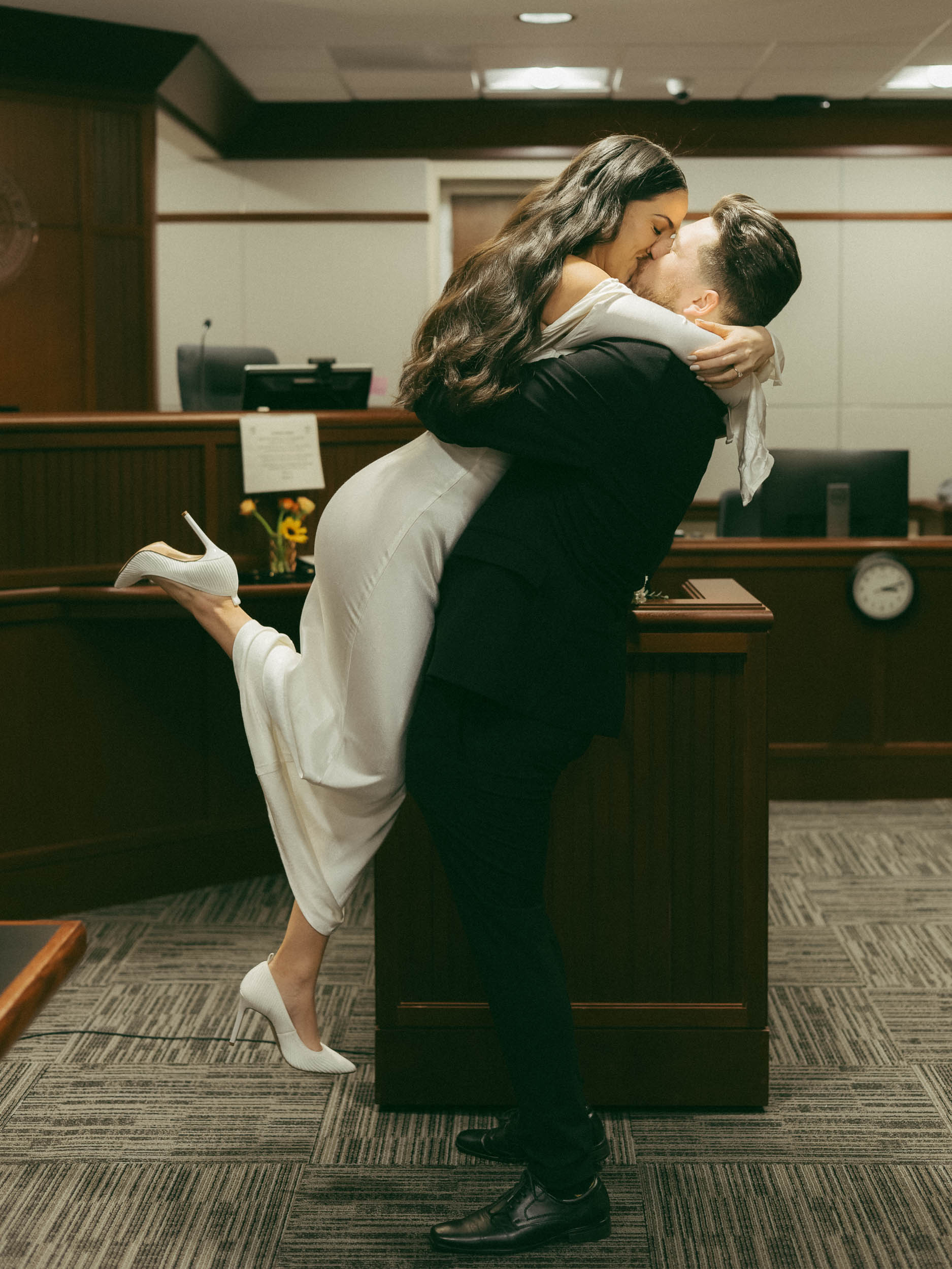 A couple kisses during their courthouse elopement in St. Louis, Missouri