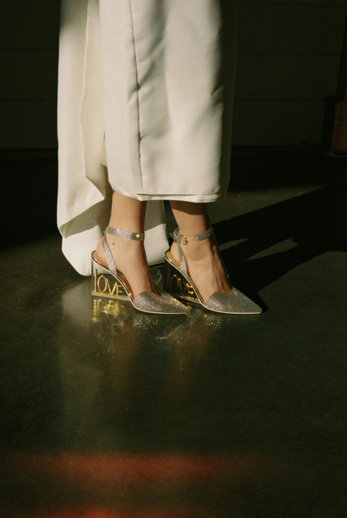 Bridal shoes and an alternative wedding dress captured with a film aesthetic and moody wedding vibe.