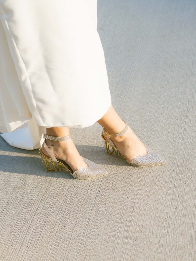 Bridal shoes and an alternative wedding dress captured with a film aesthetic.