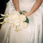 Bride holding bouquet flash 35mm