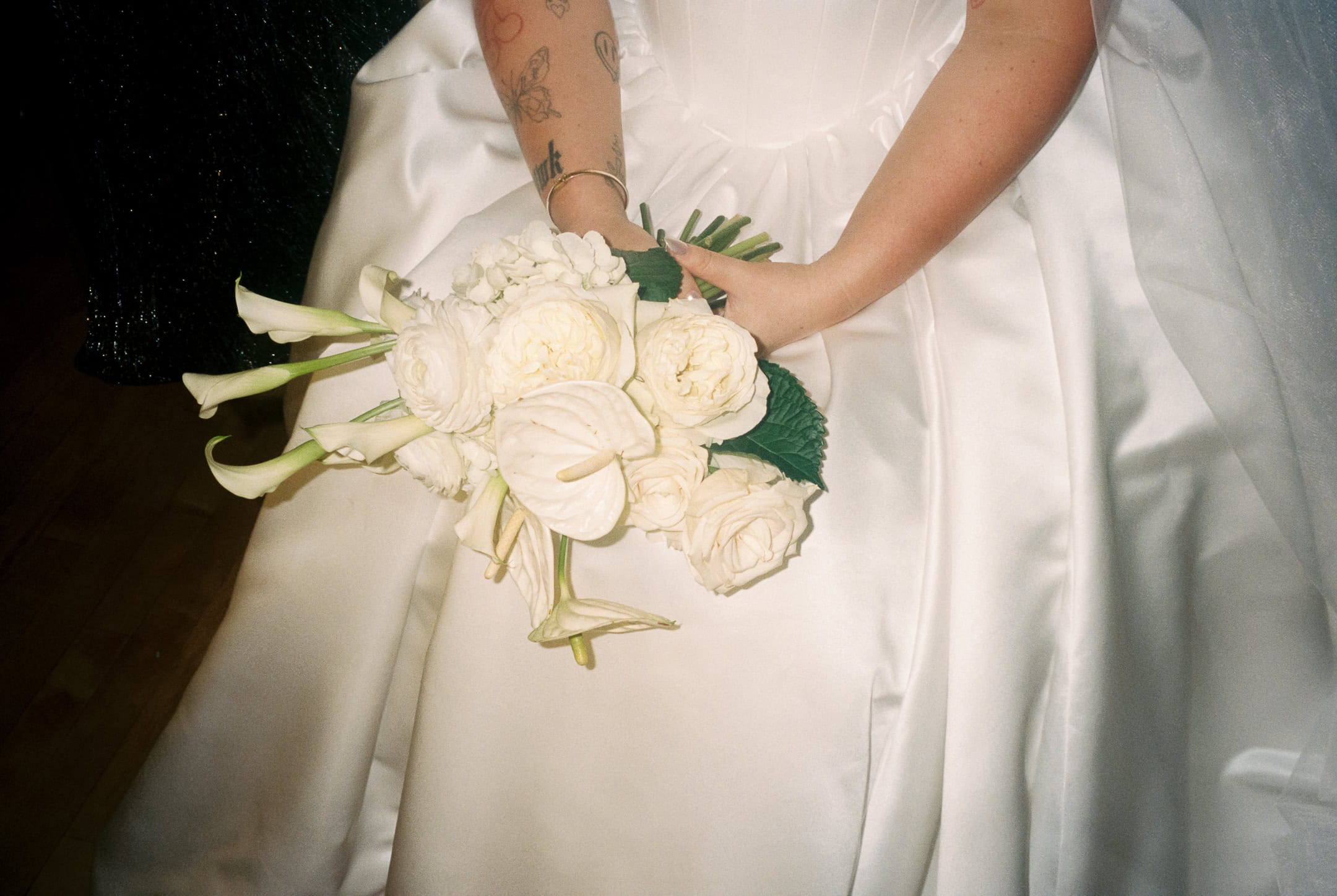 Bride holding bouquet flash 35mm