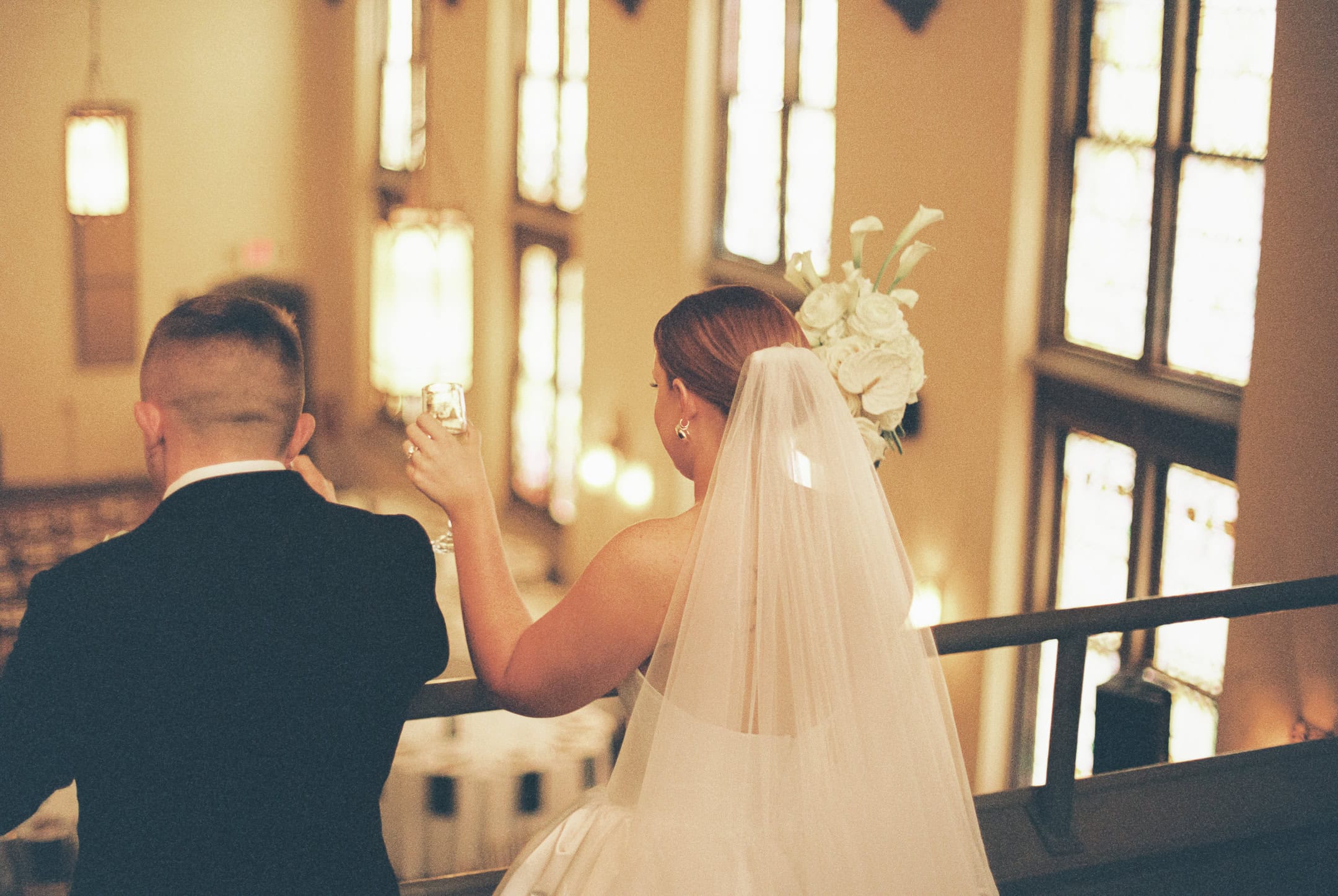 Warm film balcony bride groom toast